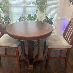High-top round wood table with 2 matching chairs