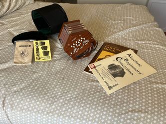 Hohner Concertina + padded bag + instructional books