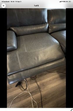 American furniture warehouse leather gray power reclining sofa gently used * local pick up only*
