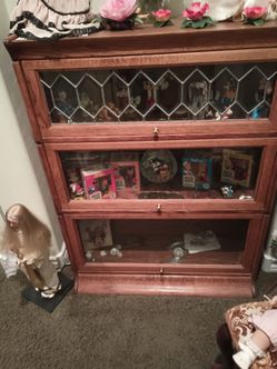 Bookshelf, lawyers, oak heavy vintage set with 3 shelves, is $500 set with 4 shelves is $700.You slide the door up after f.T open at all or perfect