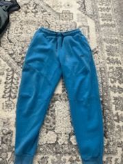 Blue Nike tech pants