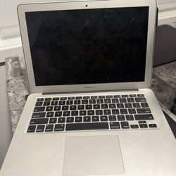 2015 MacBook Air, not sure if it turns on, no charger