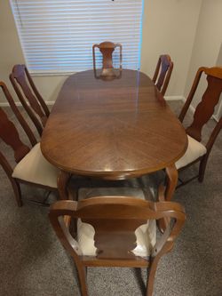 Bassett Dinning table, 6 chairs, and China hutch