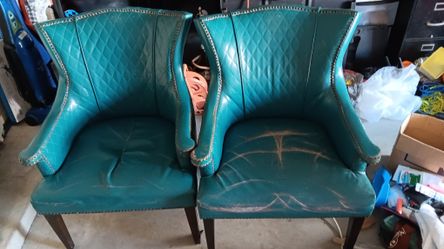 2 Matching real Leather Chairs Still In Tact Make Offer