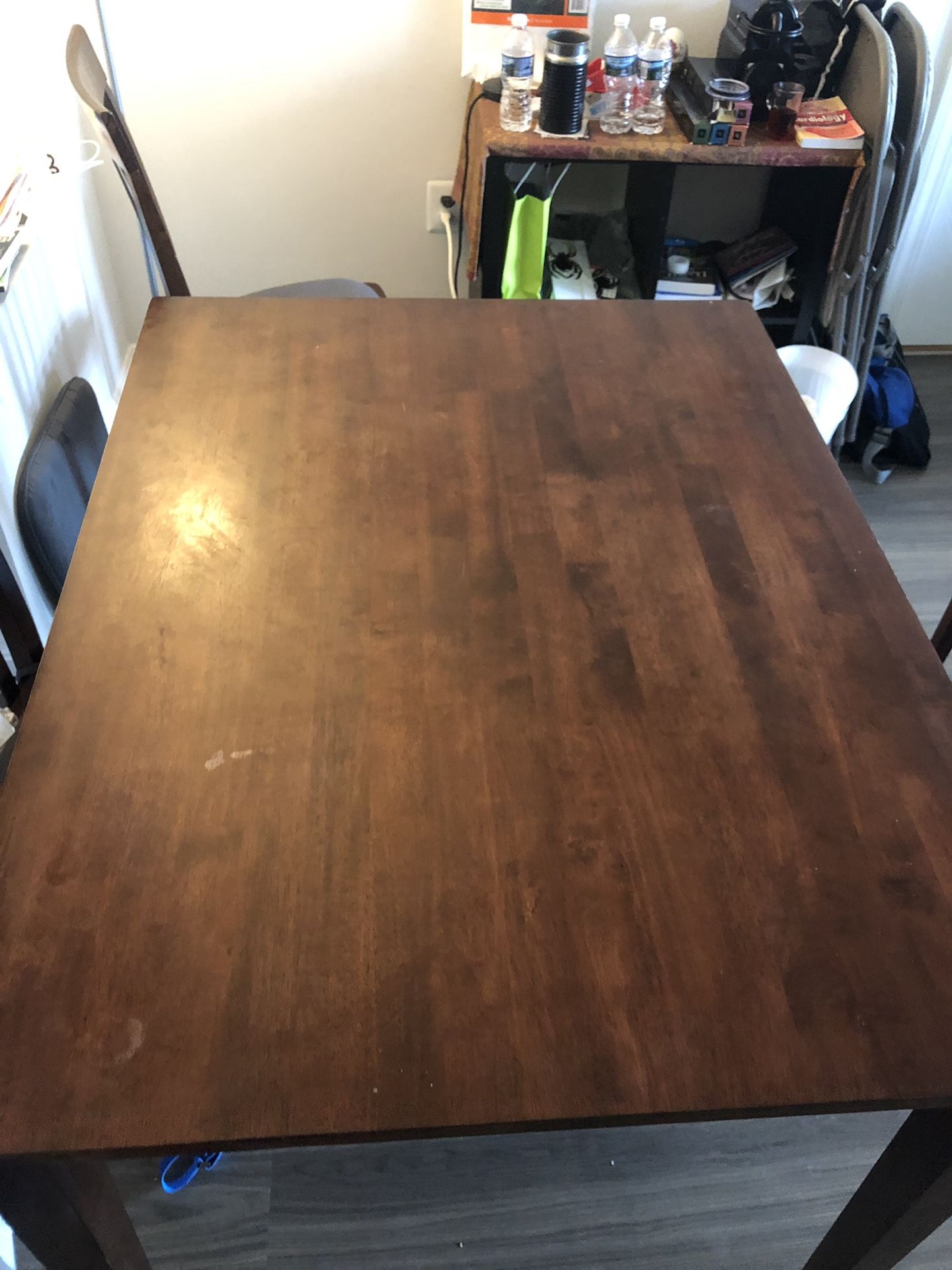 Wood dining table with three chairs