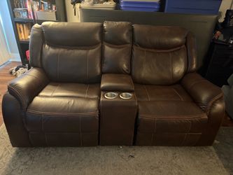 Reclining loveseat with console