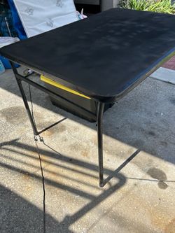 Black fold up utility table