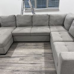 Room To Go Grey Convertible Sofa