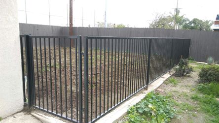 Iron bar fence with gate