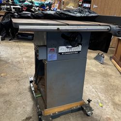 Rockwell 10” contractor table saw with extra blades and vac system.