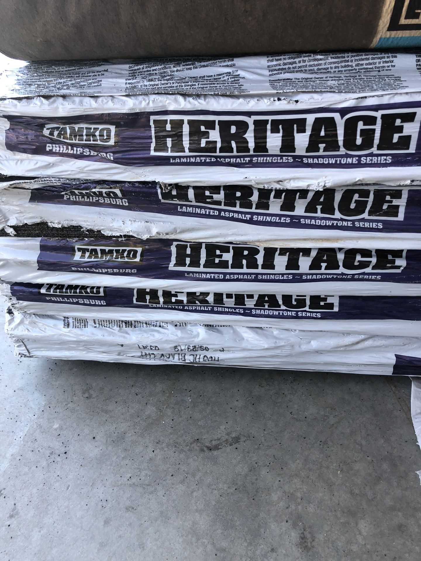 12 bundles of Tamko Heritage shingles, 4 rolls of 30 lb felt, partial bundles of starter and ridge cap shingles. Must go! Make offer!