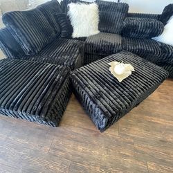 Black sectional with cup  holder