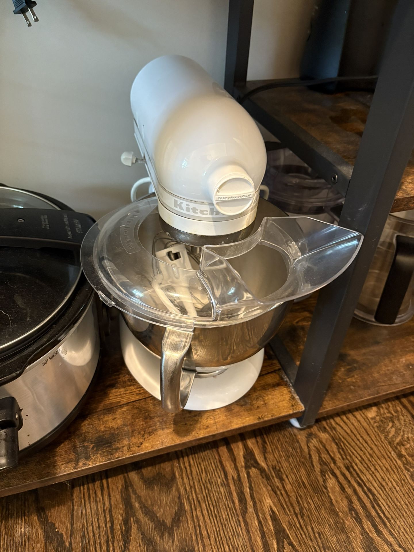 White Kitchen Aid Mixer. Works Great. It is missing the white knob on the side. Still functions fine. Comes with attachments.