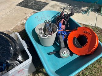 Wheel barrel, full of unidentified tools