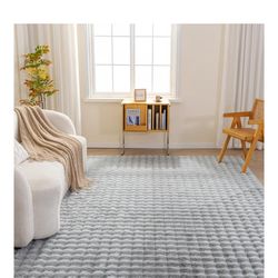 Beautiful indoor Rug New in box pick up in Pomona $55. Size in pics