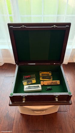 Heavy dark wood chest filled with collectable Hot Wheels and train cars
