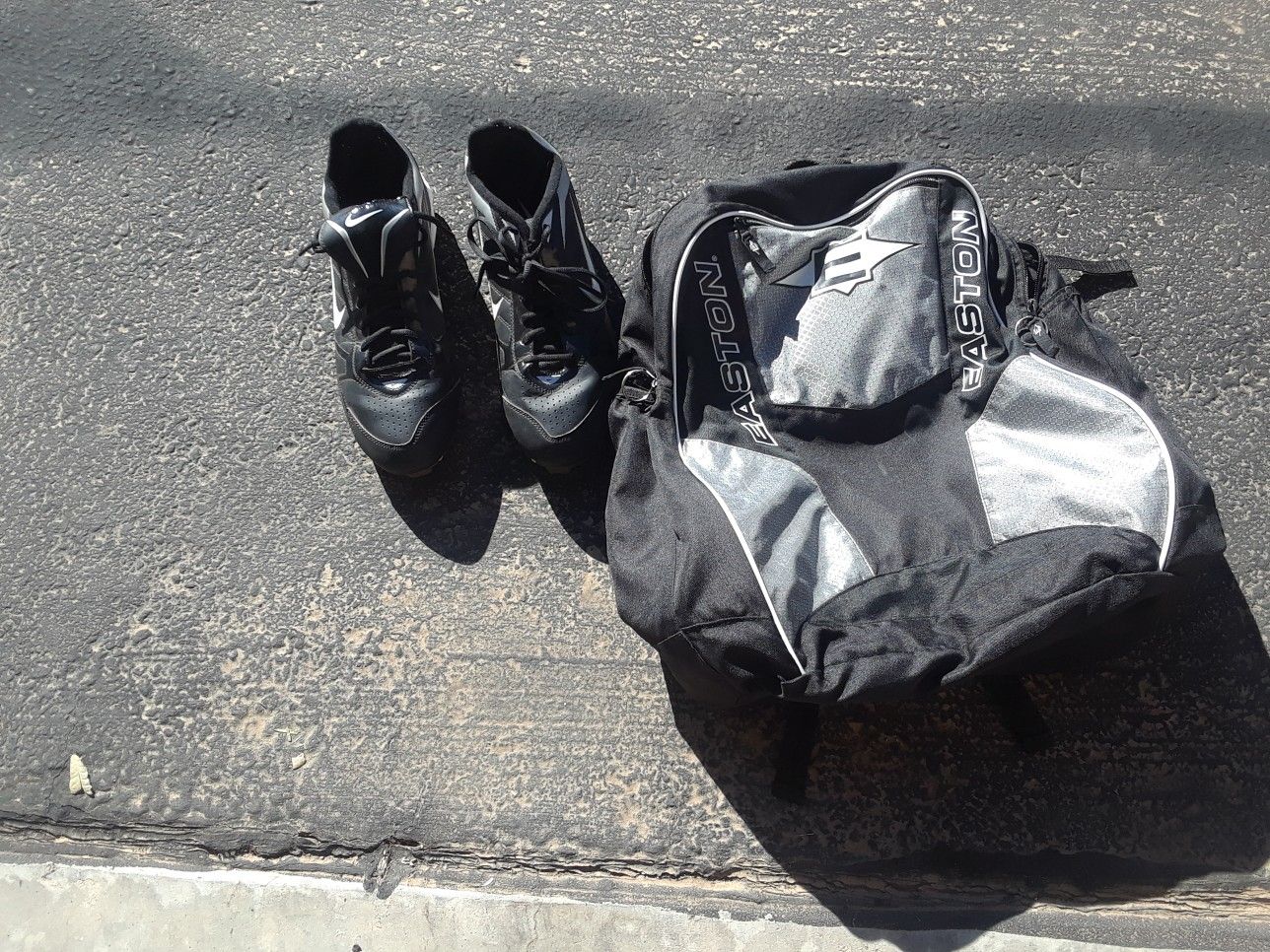 Baseball cleats and bat bag