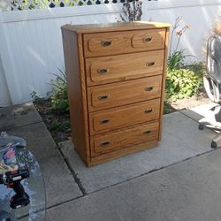 Solid Wood Five Drawer Dresser With Oak Finish And Mirror 