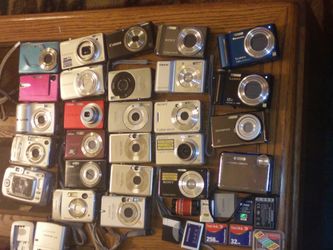 Lot of working and nonworking digital cameras plus accessories