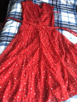 Size 2 casual red dress with white stars and a wrap around belt, worn once briefly.