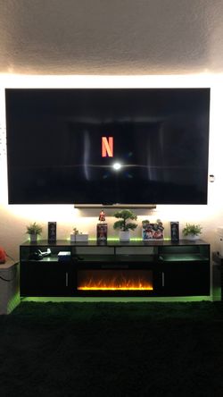 Tv an Tv floating entertainment heater stand