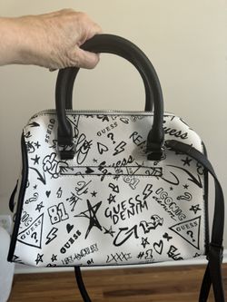 Like NEW Guess purse. Nice design of black print on white bag