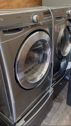 LG set  washer and dryer stainless steel front load with pedestal