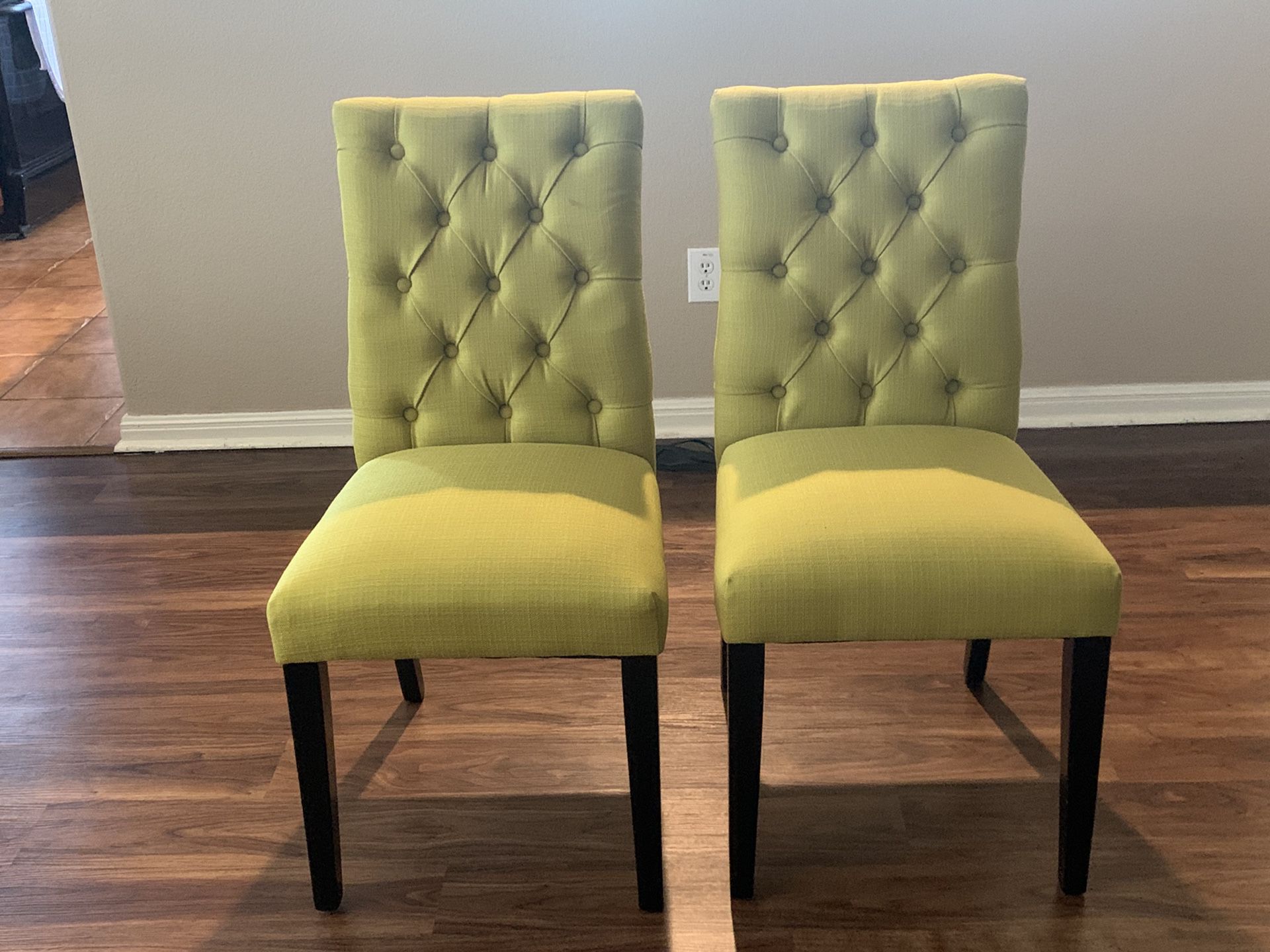 2 lime green chairs - black wooden legs
