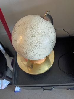 Golden globe with golden stand