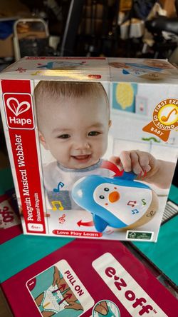 Baby Penguin musical wobbler - like new