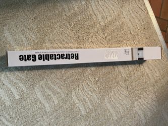 Retractable gate NEW unopened 65 inch grey