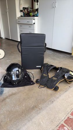 New, never been used Youth football helmet, pads and blocking pad