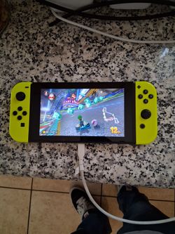 Nintendo switch system with joycons and games installed plus charger