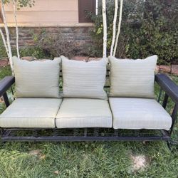 Vintage metal glider with cushions
