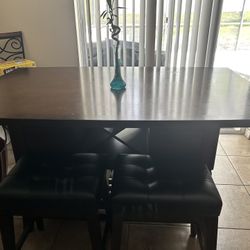 Sectional, dinning room table, kitchen table, fire place , bar stools. 