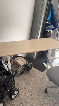 Adjustable stand up desk with chair.