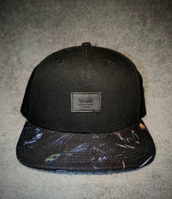 Black Vans cap with floral pattern on the visor