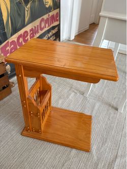 Light polished wood magazine storage/side table