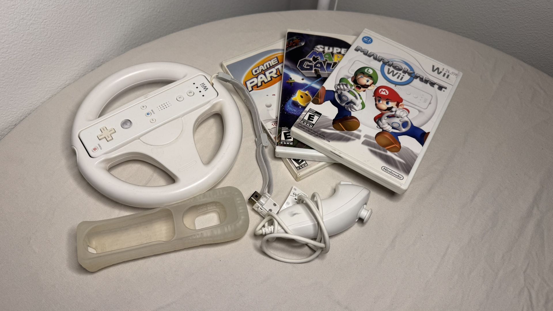 Nintendo Wii Bundle — Steering Wheel + Nunchuk + 3 Games — Great Condition
