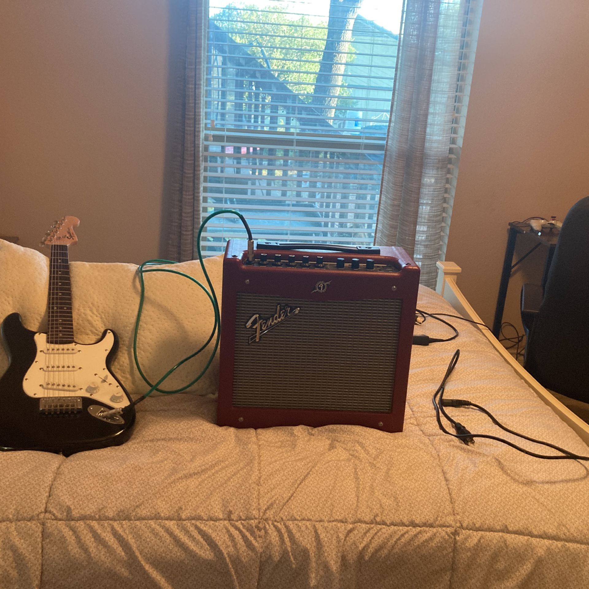 Electric guitar with amp and power cord
