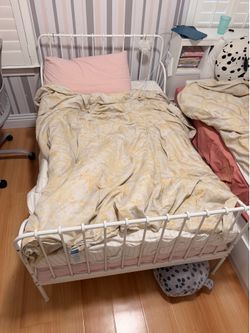 White bed frame with mattress
