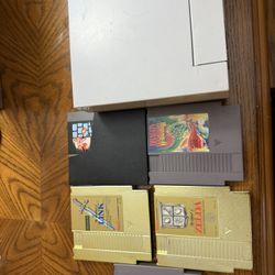 NES Nintendo Original Console with 2 controllers and 5 cartridge  2 zelda, 1 super mario and 2 Dragon warriors  Will not separate  Tested and it works