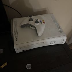 xbox 360 with games and controllers 