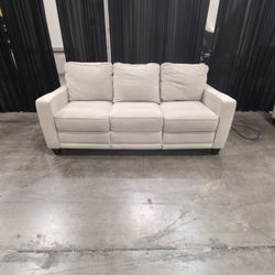 Tan Fabric Three-Seat Reclining Couch with Piped Edges