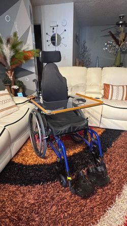 Tilt-in-Space Wheelchair with Headrest and Lap Tray