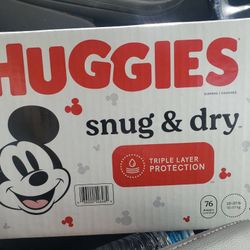 2 Boxes Of Huggies Size 4