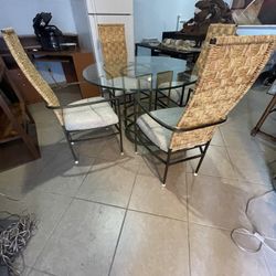 Glass Dining Table with Wicker Chairs