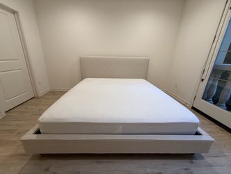 Living Spaces Dean king bed frame with bunkie boards, sand upholstered