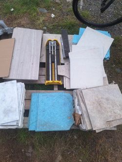 Assorted Tiles And Tile Cutter
