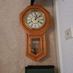 D AND A CLOCK WITH PENDULUM 